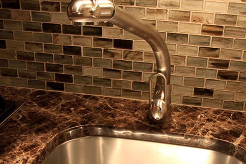 Sink and Tiled Backsplash